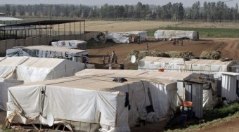 Refugiados sírios na fronteira com Líbano em 19 de junho. / BILAL HUSSEIN (AP)