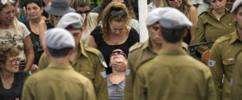 Einat , the mother of Israel soldier Amit Yeori, mourns during his funeral in Jerusalem
